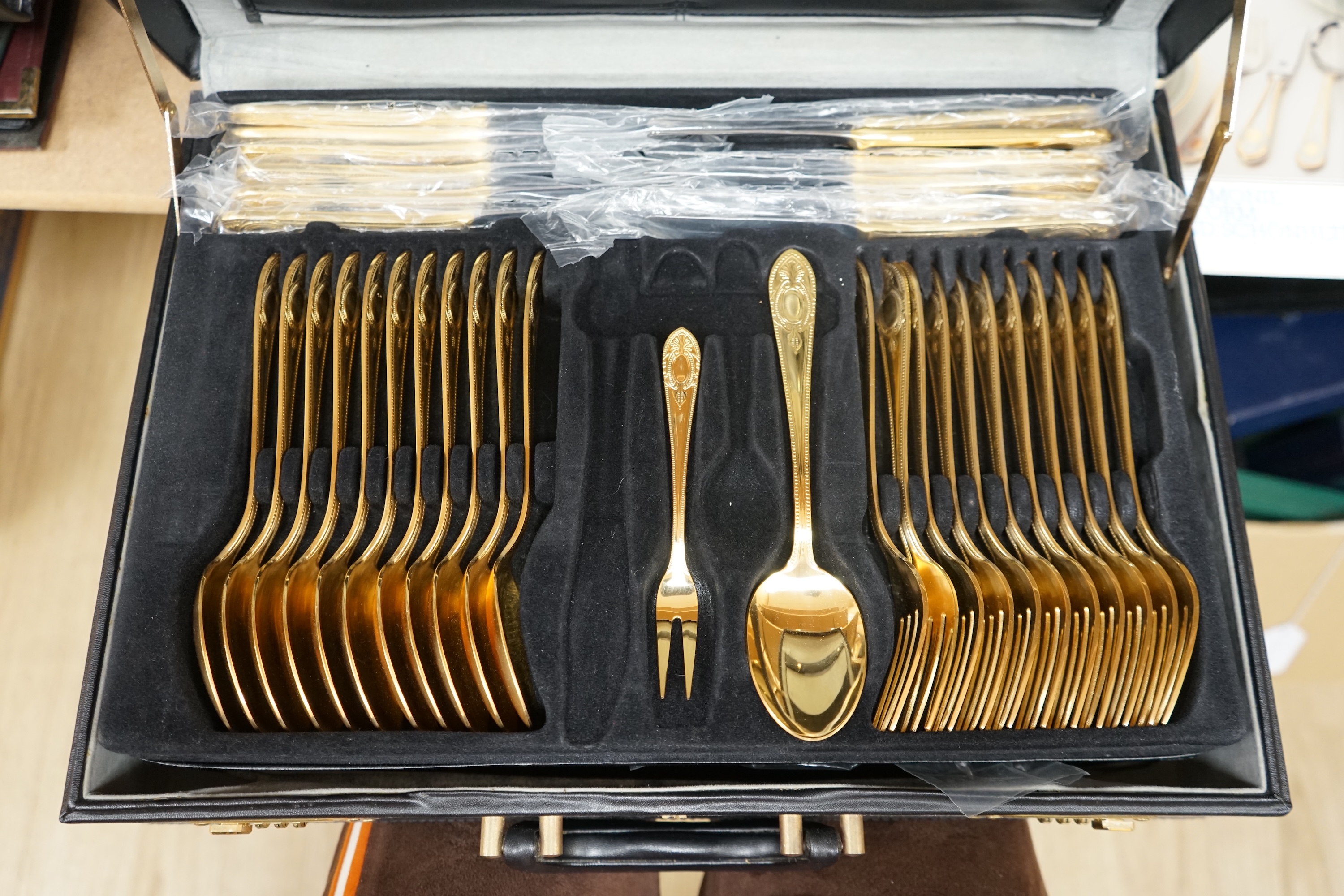 A Bestecke gold plated canteen of cutlery. Condition - good